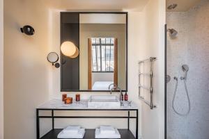 a bathroom with a sink and a mirror at Maison Honnel in Paris +37 photos