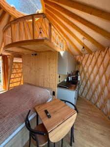 a bedroom with a bed and a table in a room at Forest Marina 