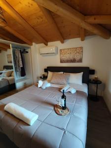 a bedroom with a large bed with a table on it at Alvesta Guest House in Nafplio