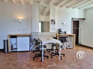 an empty room with a white table and chairs at La Roche des Eaux Vives, 2 personnes in Fromentières +23 photos