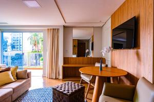 a living room with a couch and a table at Prive Thermas Hotel by WAM Experience in Caldas Novas