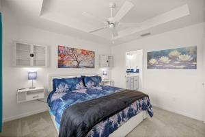 a bedroom with a bed and a ceiling fan at Spacious 3BR - Sleeps 7 - King Bed - Lanai in Okahumpka