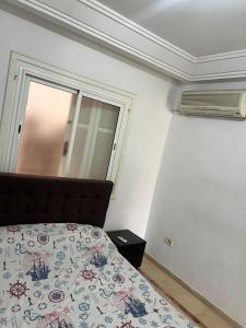 a bedroom with a bed and a window at Dar El vague in Hiboun