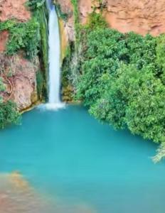 an aerial view of a waterfall in a forest at Casa D' Familia in Alte