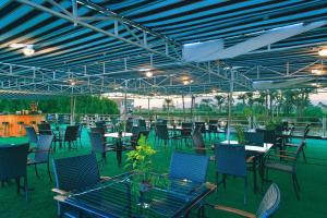 a group of tables and chairs under a large tent at Sun Nile Cruise in Aswan +6 photos
