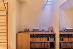 a kitchen with a sink and a staircase at The Square in Copenhagen +83 photos
