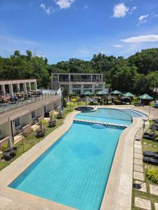 an overhead view of a swimming pool at a hotel at Jade Resort - Bauang, La Union in Bauang