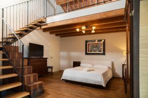 a bedroom with a bed and a staircase at Podere Luna Stella in Bellaria-Igea Marina +58 photos