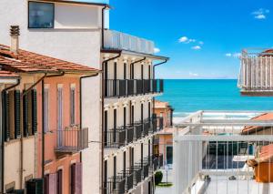 a view of the ocean from a building at Hotel Stella D'Italia in Viareggio