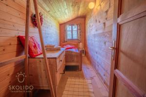 a small room with a desk in a tiny house at Cosy Chalet in Brig-Glis in Glis +7 photos