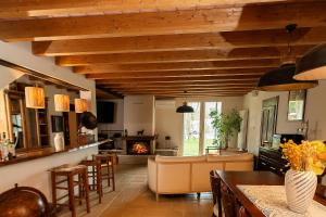 a kitchen with a living room with a fireplace at Podere Luna Stella in Bellaria-Igea Marina