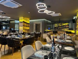 a restaurant with tables and chairs and a bar at AHC Old City Hotel in Istanbul +77 photos