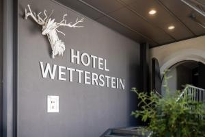 a hotel sign on the side of a building at Hotel Wetterstein by keyone in Seefeld in Tirol