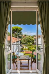 a view from the balcony of a house at Hotel Liu in Lido di Camaiore