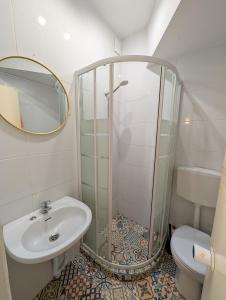 a bathroom with a shower and a sink at Travel & Live Marques in Porto +38 photos