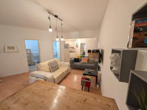 a living room with a couch and a table at Travel & Live Marques in Porto