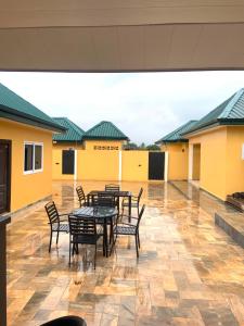 a group of tables and chairs on a patio at Archelux Developments in Bawalishi