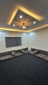 a large room with couches and a projection screen at عجلون in Ajloun