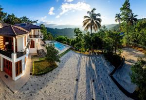 an aerial view of a villa with a swimming pool at Sunset Hill Resort in Kandy