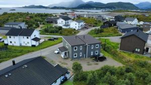 an aerial view of a small town with houses at Cozy Lofoten Hideaway in Leknes