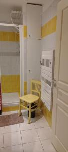 a room with a table and a bed and a door at Les Fermes du Lac - Appt 10A in Gérardmer +6 photos