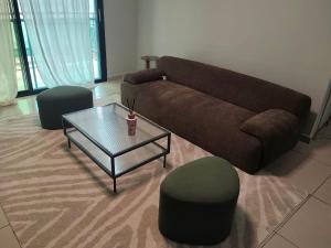 a living room with a couch and a coffee table at Hcp appartement in Abidjan