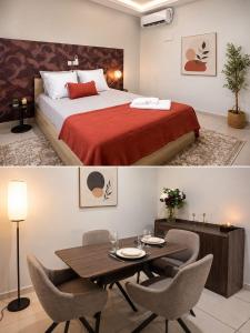 a hotel room with a bed and a table and chairs at Hcp appartement in Abidjan