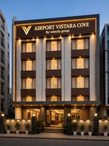 a building with a sign that reads airport vyssaria cove at Airport Vistara Cove By Velocity Group Terminal 2,3 Delhi IGI Airport With free Airport Pickup in New Delhi