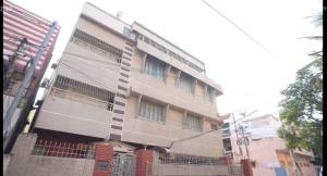 a tall building with a fence in front of it at Luxurious Duplex Villa in Hyderabad