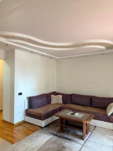 a living room with a couch and a coffee table at Dunav View Residence - River View Free Parking in Belgrade