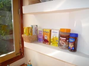 a shelf with some food items on it at CasaJardín in Rosario