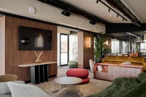 a living room with a couch and a table at Best Western Hotel Biri in Padova