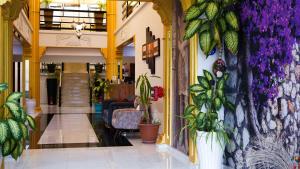 a lobby with plants on the wall at EnkayaHotel in Nicosia