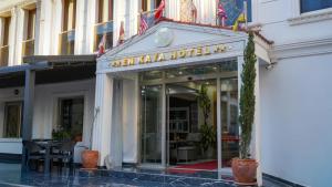 a restaurant with a sign on the front of a building at EnkayaHotel in Nicosia +24 photos