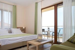 A bed or beds in a room at ApartHotel Belvedere Residence Becici Budva