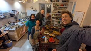 a group of people posing for a picture in a kitchen at The Kalavan Retreat Center in Chambarak +48 photos