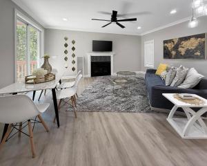 a living room with a blue couch and a table at Charlotte NC in Charlotte