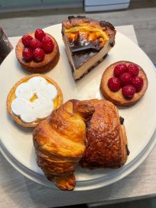 a plate of pastries and desserts on a table at À Plus, Lectoure in Lectoure