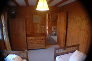 Voodi või voodid majutusasutuse Chalet Valdonga toas