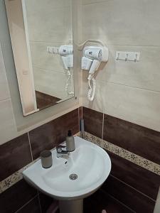 a bathroom with a sink and a mirror at Villa Stefan Ohrid in Ohrid +47 photos