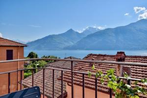 a balcony with a view of the water and mountains at Studio Bellavista in Acquaseria