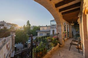 a balcony with a view of a city at Aren Cave Hotel And Art Gallery in Göreme