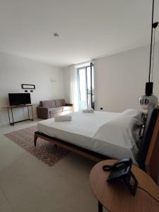 Llit o llits en una habitació de Hotel Pietranera