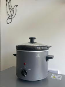 a slow cooker sitting on top of a counter at Foundry Street Apartment 3 - Dunfermline City Centre in Dunfermline