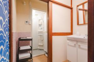a bathroom with a sink and a mirror at Odawara Nautical Nook in Odawara +61 photos