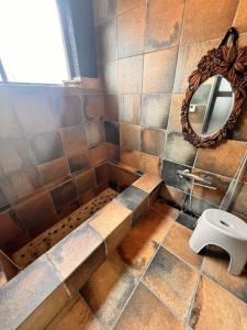 a bathroom with a shower with a toilet and a mirror at nostalgia2 ノスタルジア2 in Yokosuka +50 photos