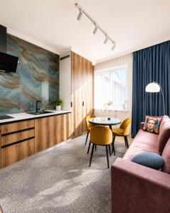a living room with a couch and a table at Mountain View "Green Apartment" in Mukacheve