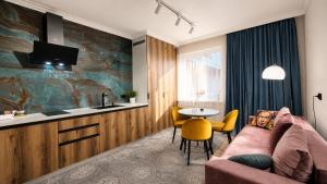 a living room with a couch and a table at Mountain View "Green Apartment" in Mukacheve