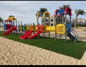 a playground on the beach near the sand at Nozha Beach للعائلات in Ras Sedr