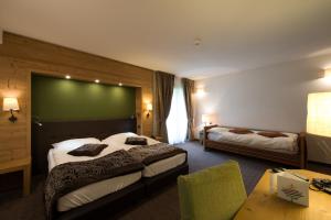 Postel nebo postele na pokoji v ubytování Hotel Vedig